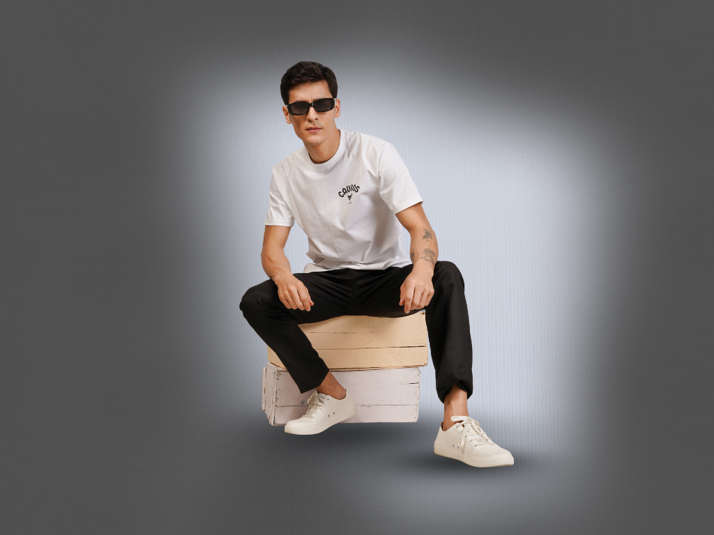 The Spirit Behind the Name – What Cavros Truly Means, man wearing sunglasses and casual outfit sitting on a box.