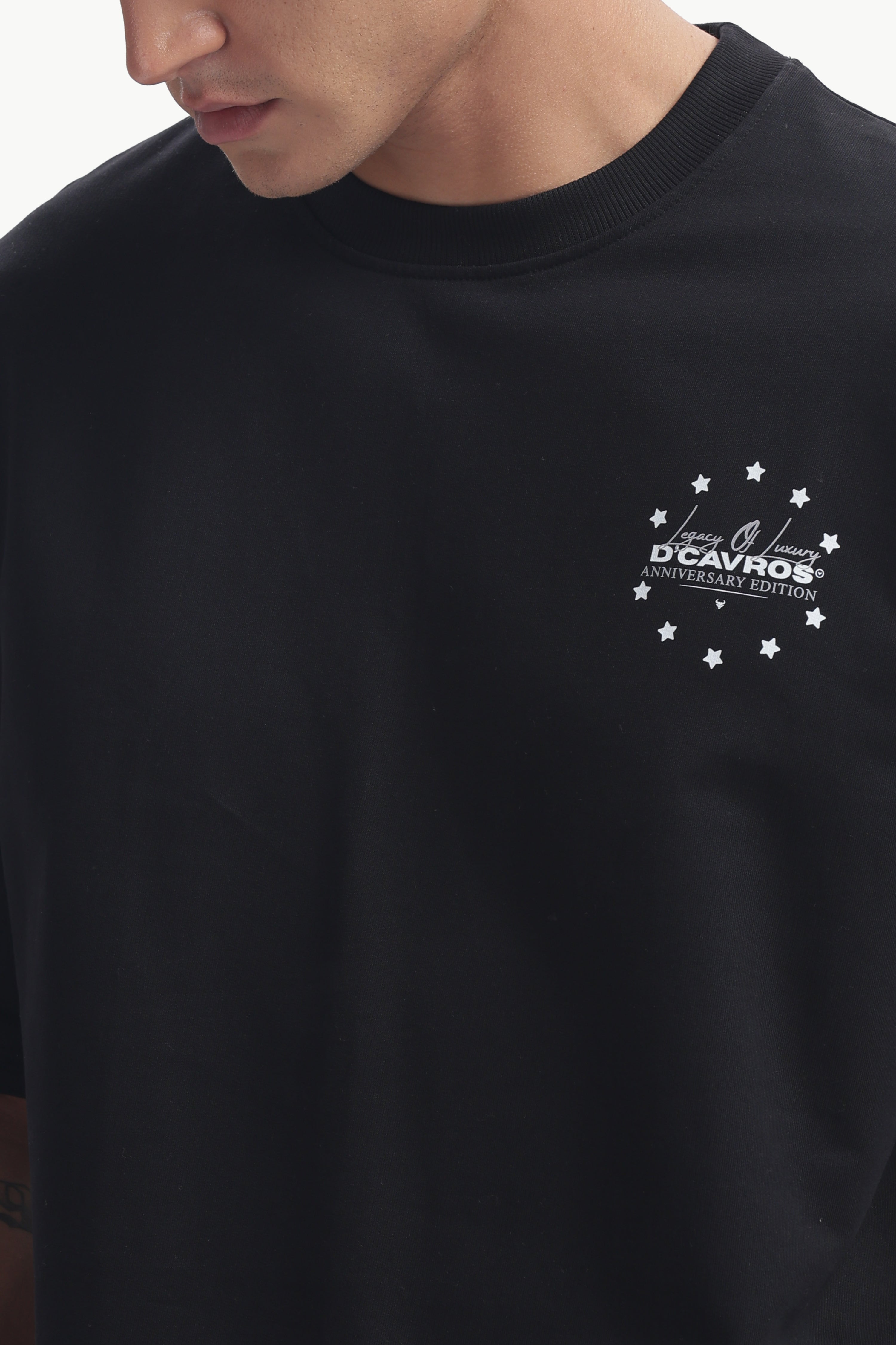 Loose Fit Legacy Printed T-Shirt featuring anniversary graphics on a stylish black background.