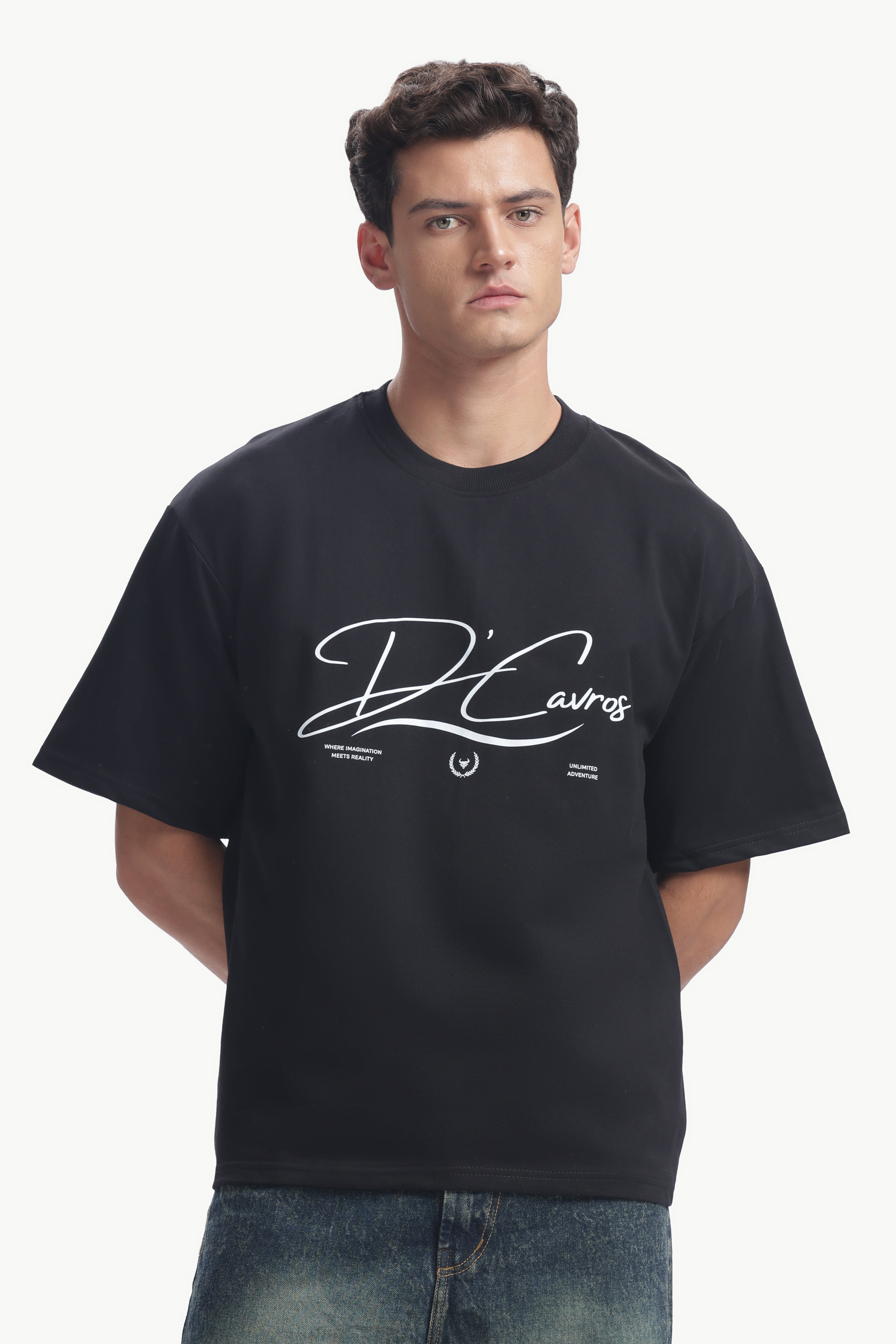 Model wearing Community Capsule Graphics Tee with bold typography and relaxed fit in black.