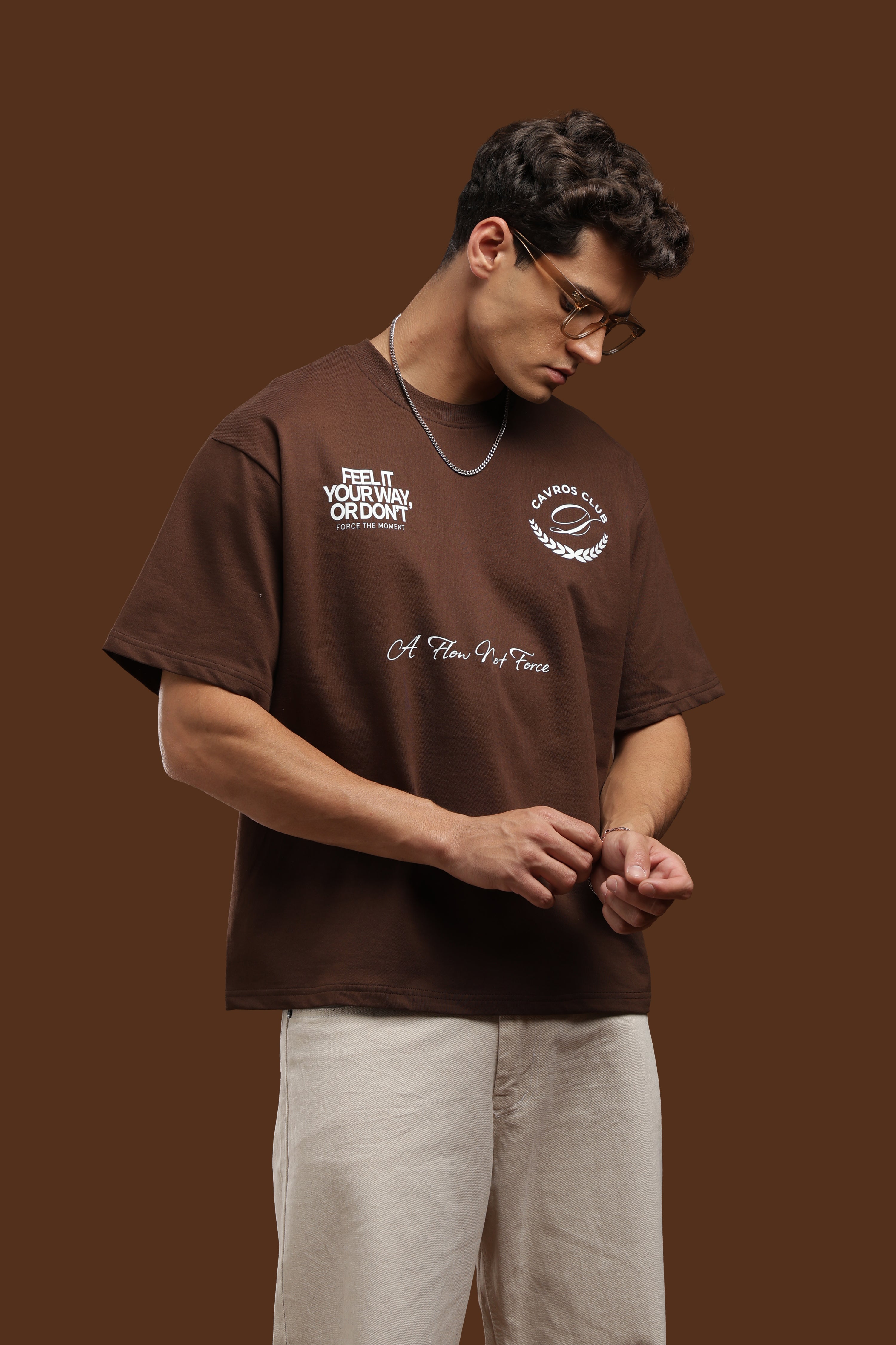 Oversized Fit Club Printed T-Shirt in brown with casual graphics and relaxed fit on model.