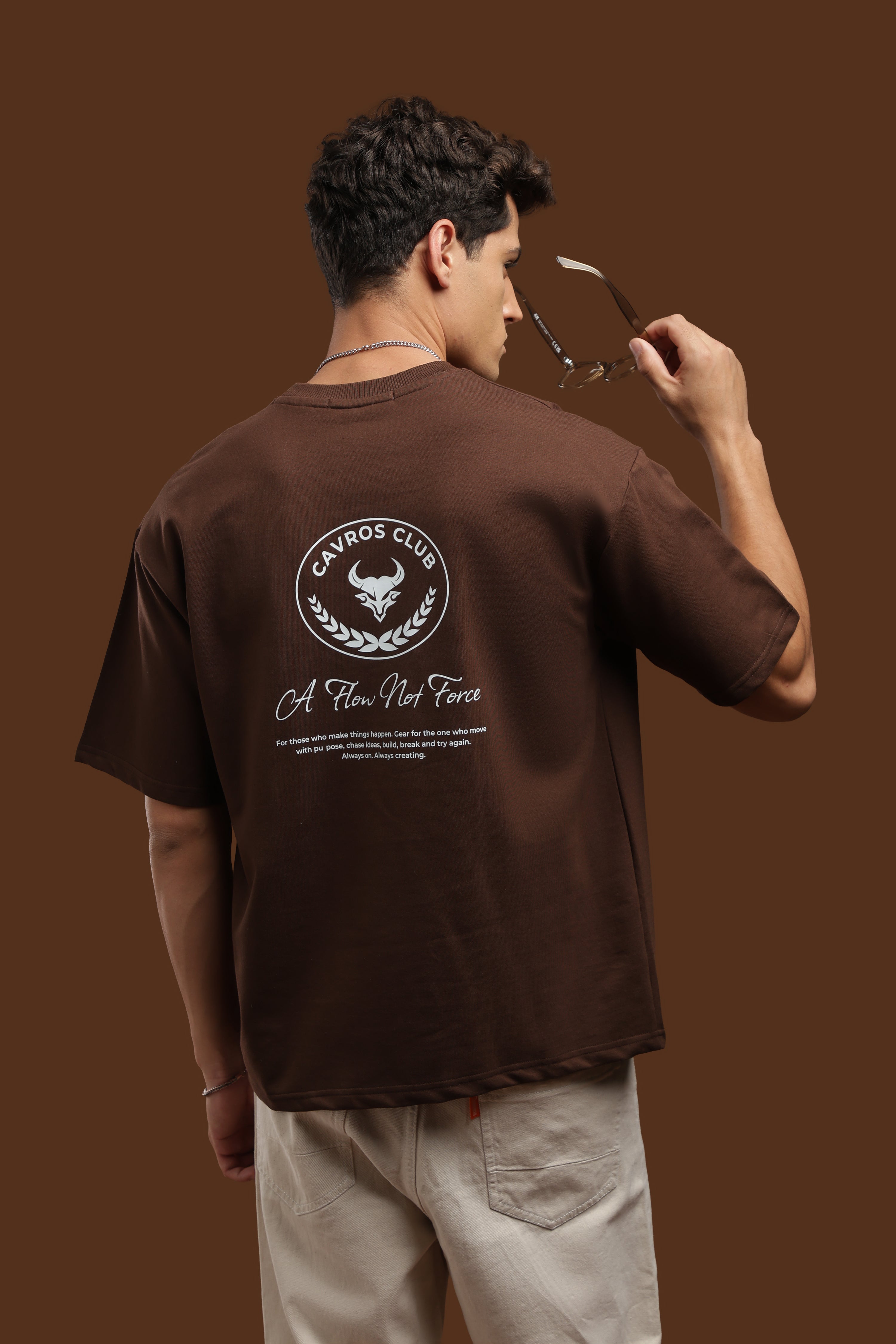 Oversized Fit Club Printed T-Shirt displayed on a model showing the back graphic design in a relaxed pose.