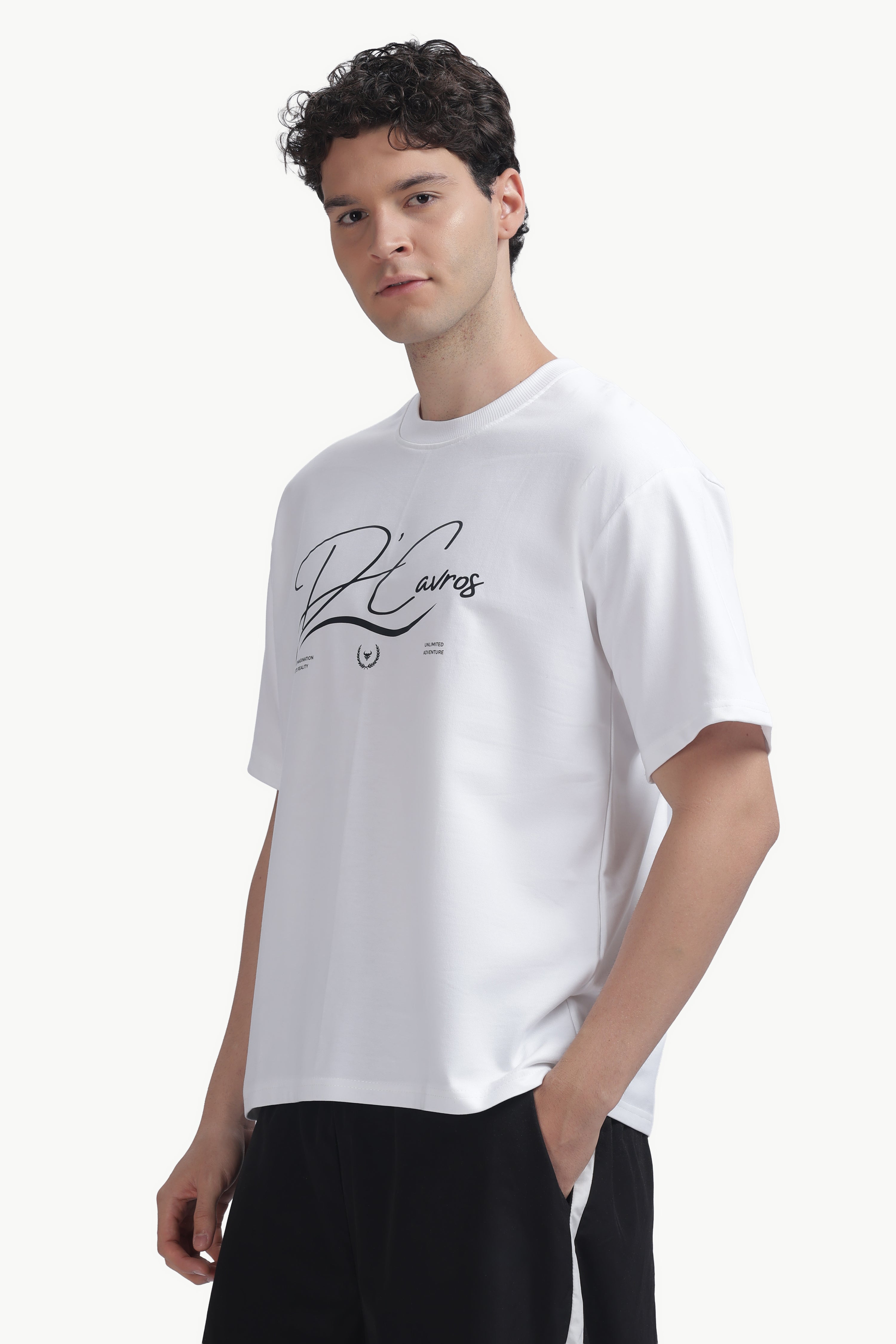 Model wearing the Community Capsule Graphics Tee featuring bold typography and a relaxed fit.