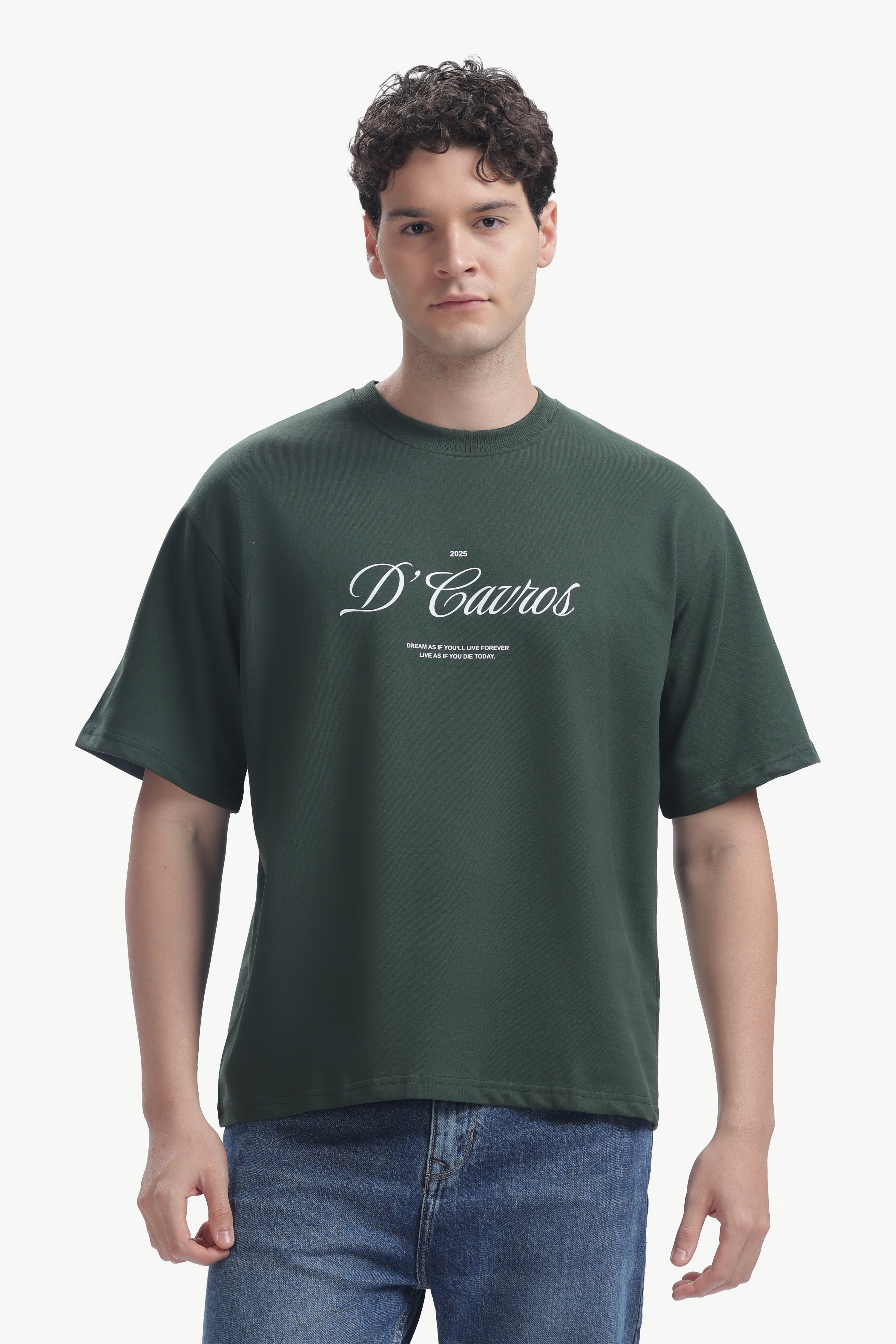 Classic Loose Fit Typography T-Shirt worn by a model in green, featuring bold D'Cabros script and relaxed fit.