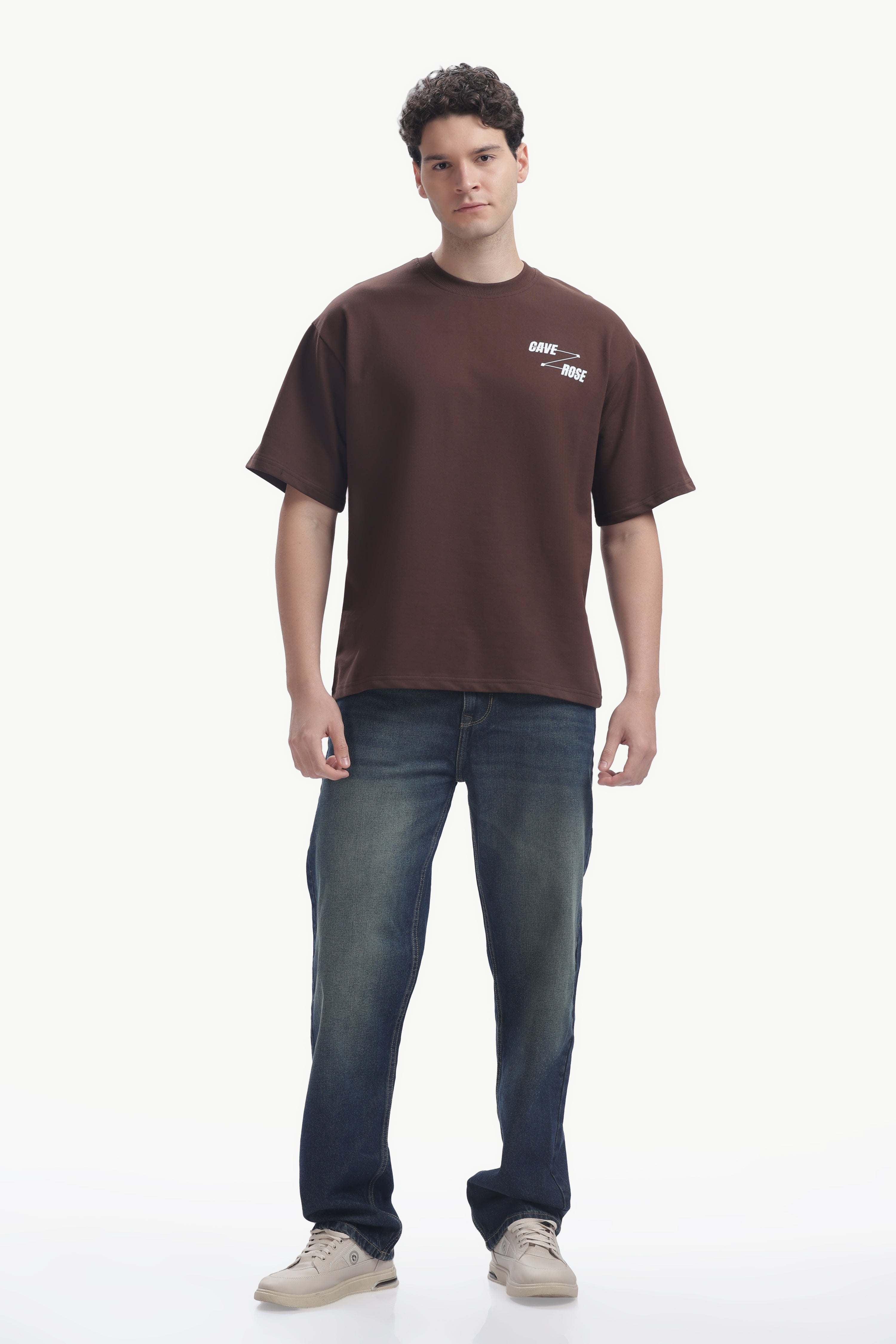 Cave-Rose Creative Studio Graphics Tee worn by man, featuring bold typography on premium cotton fabric.