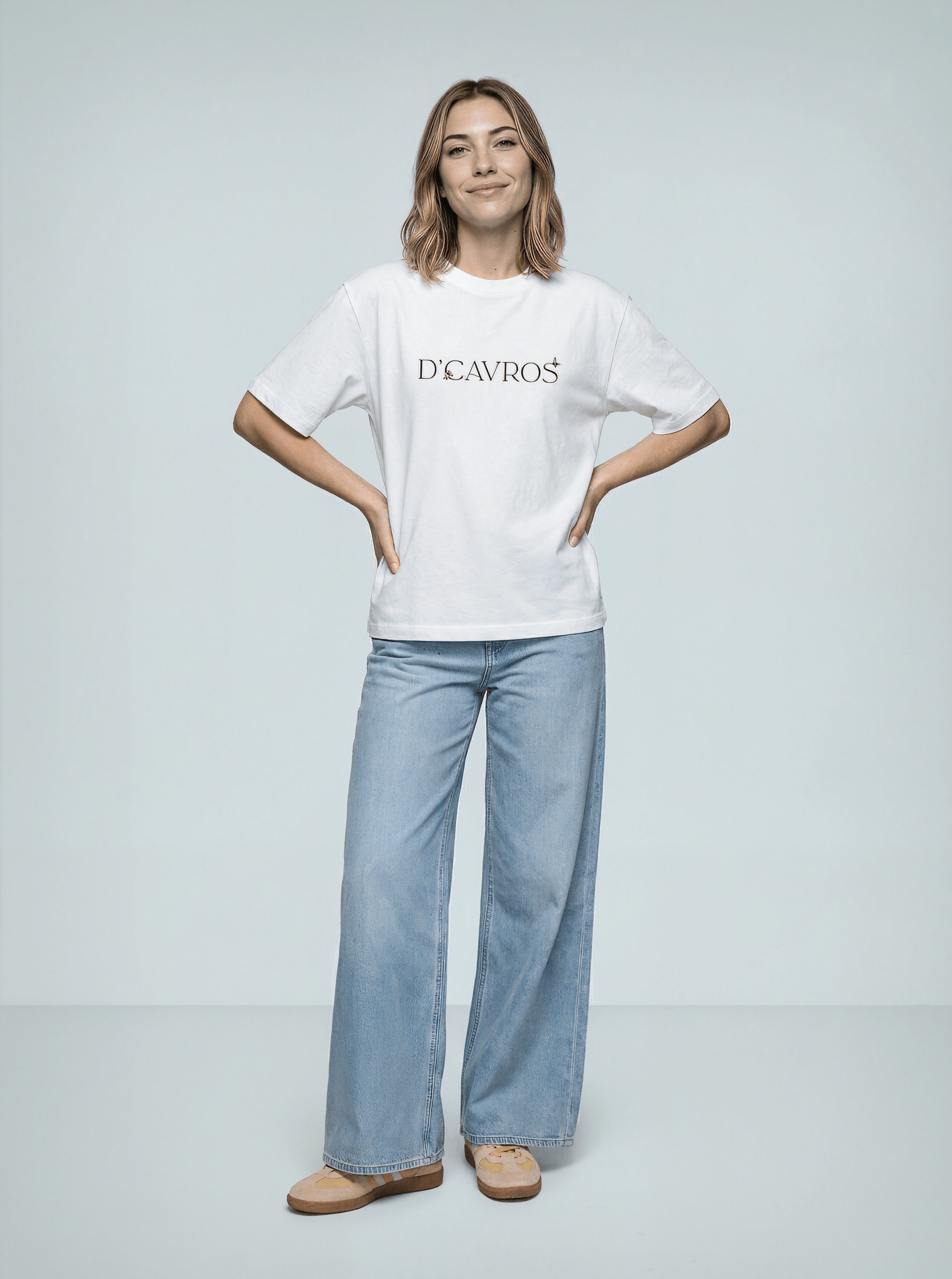 Model wearing an Oversized Graphics Printed T-Shirt with relaxed fit and bold print, paired with wide-leg jeans.