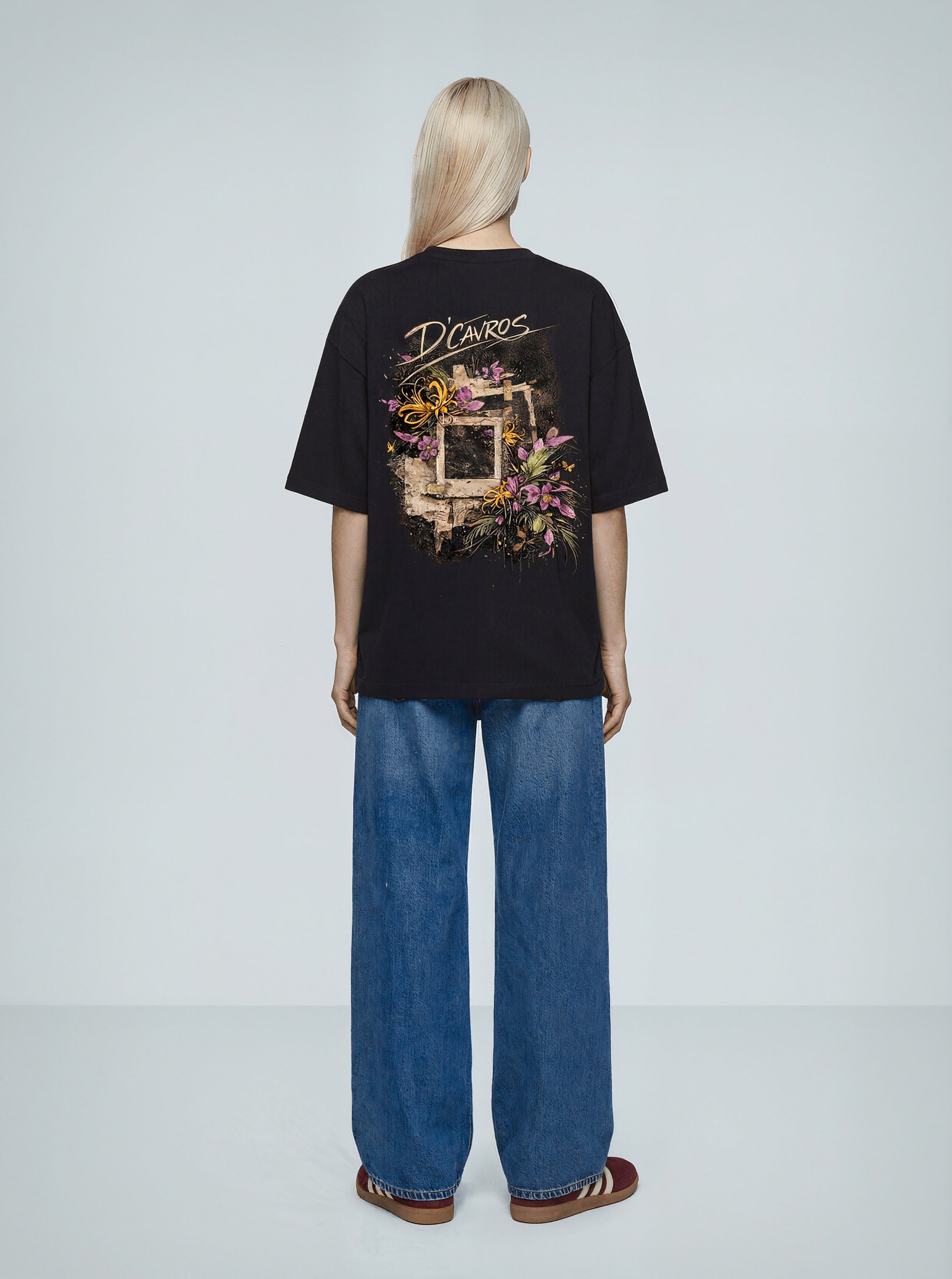 Oversized Printed-Frames T-Shirt featuring floral frame back print by D’Cavros, worn with relaxed jeans.