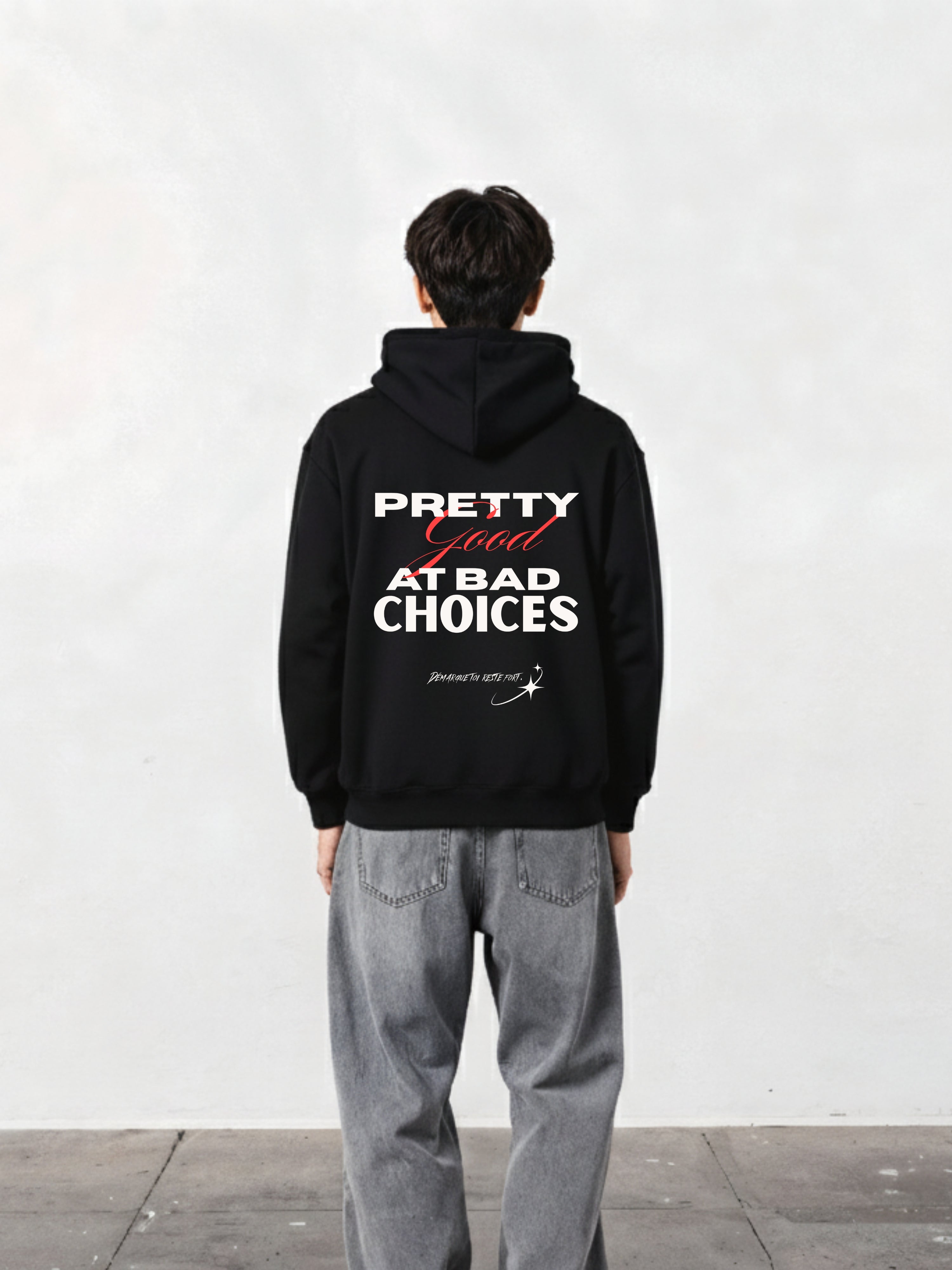 Back view of a person wearing D'Cavros Rebellion Unisex Hoodie featuring the phrase 'PRETTY GOOD AT BAD CHOICES'.