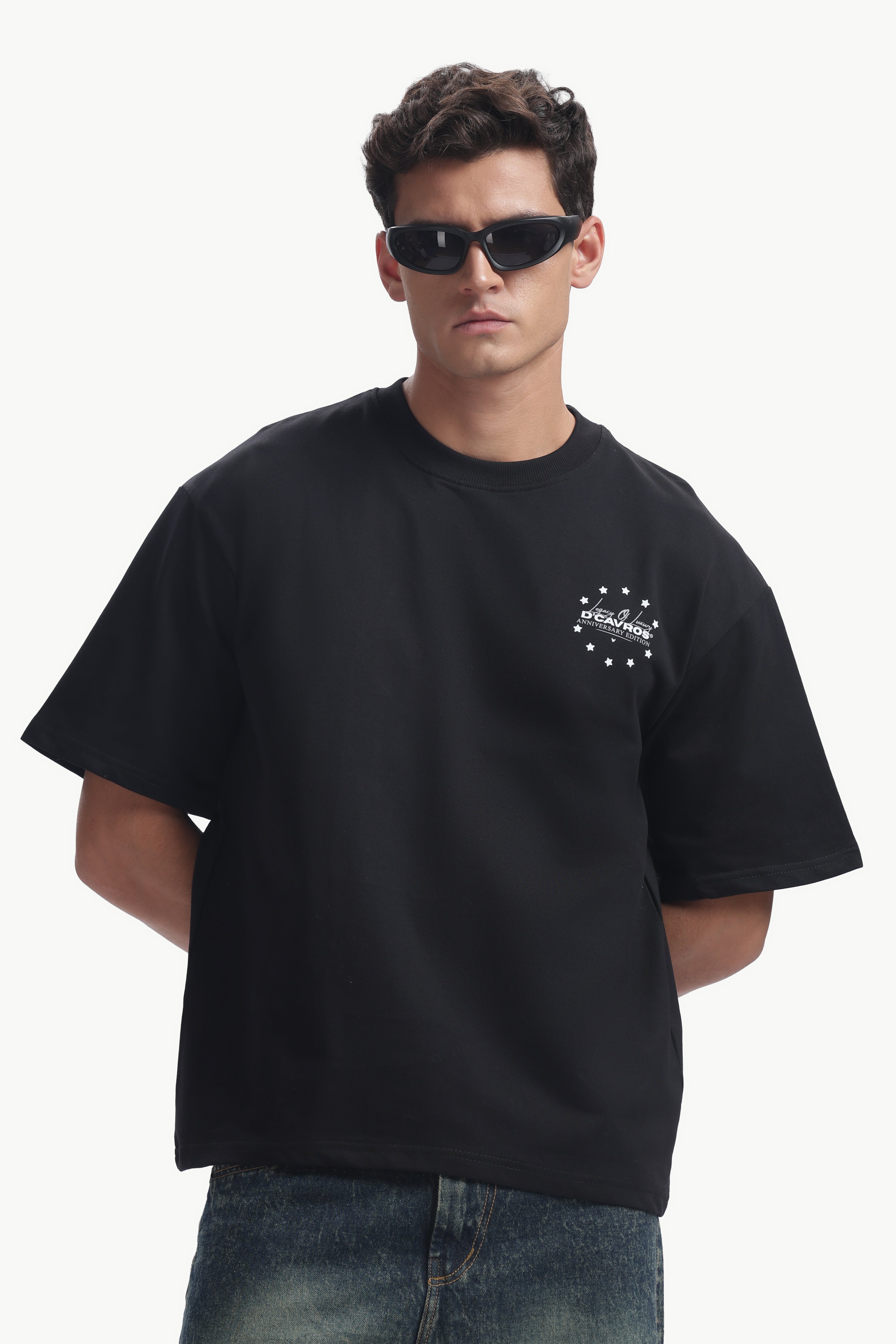 Loose Fit Legacy Printed T-Shirt worn by a model, featuring a relaxed fit and bold graphics for street luxury style.