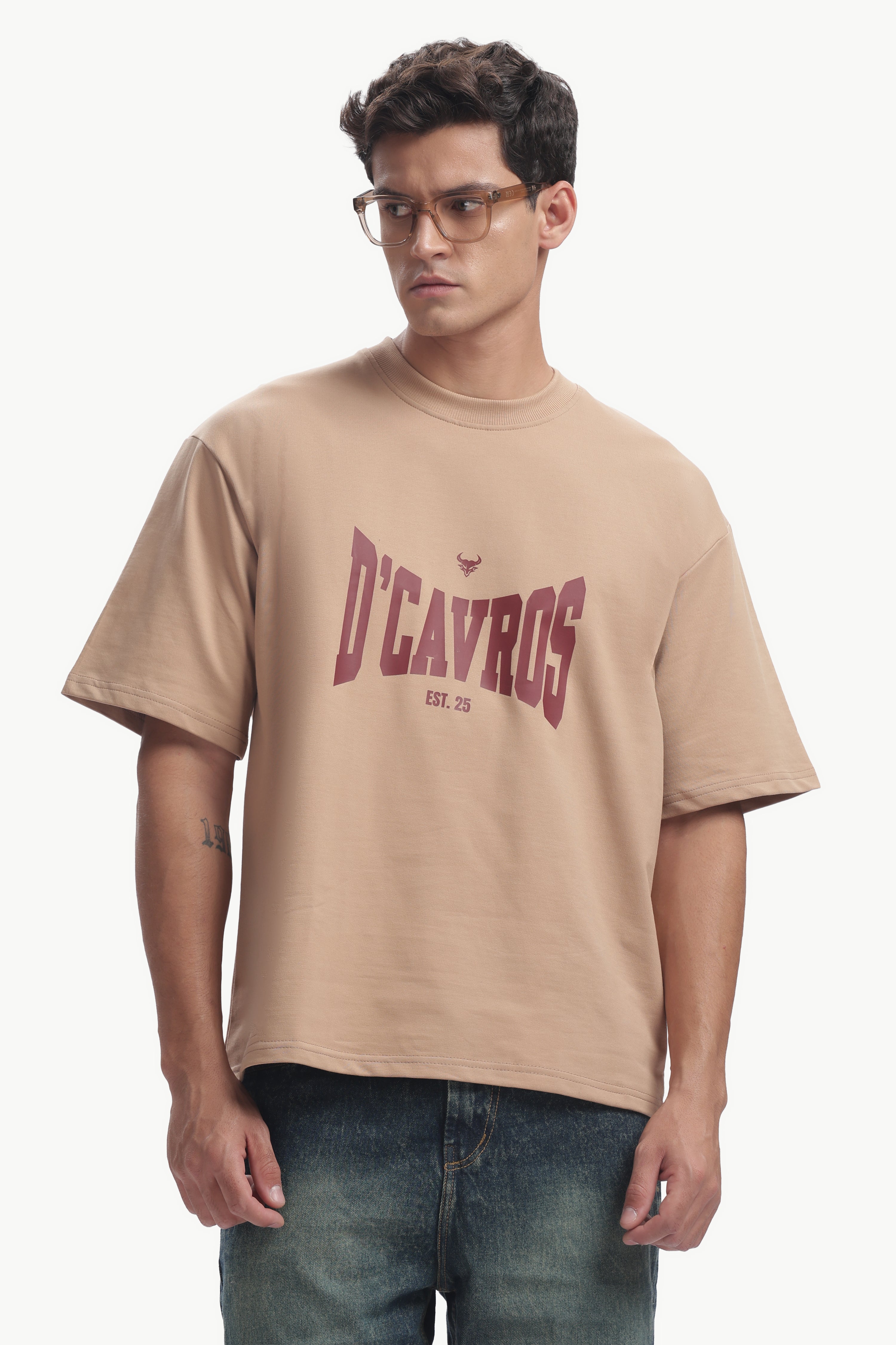 Classic Typography Oversized Fit T-Shirt in beige with D'Cavros graphic design, showcasing premium comfort and style.
