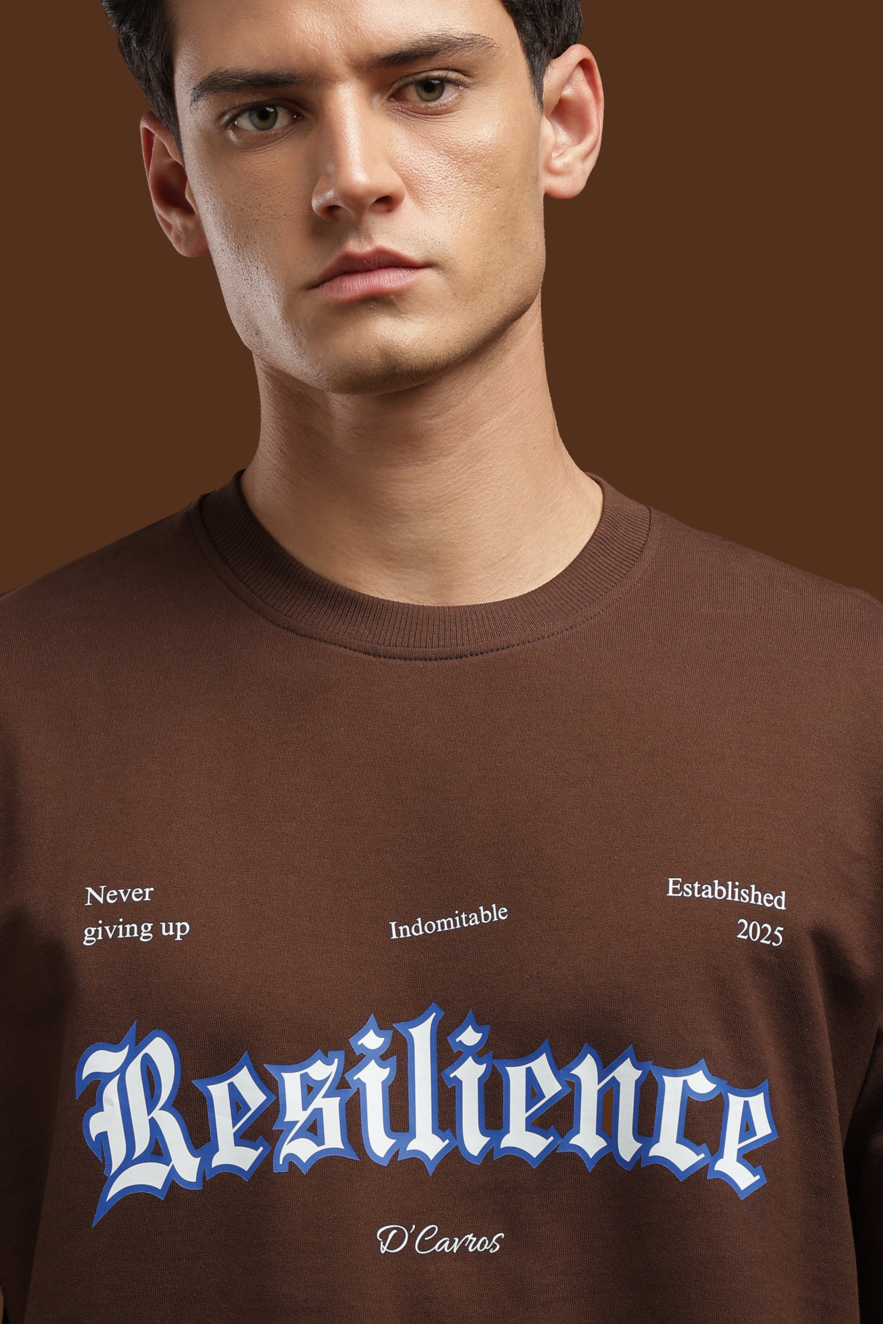 Loose Fit Resilience Printed T-Shirt featuring bold typography and relaxed silhouette on a model.