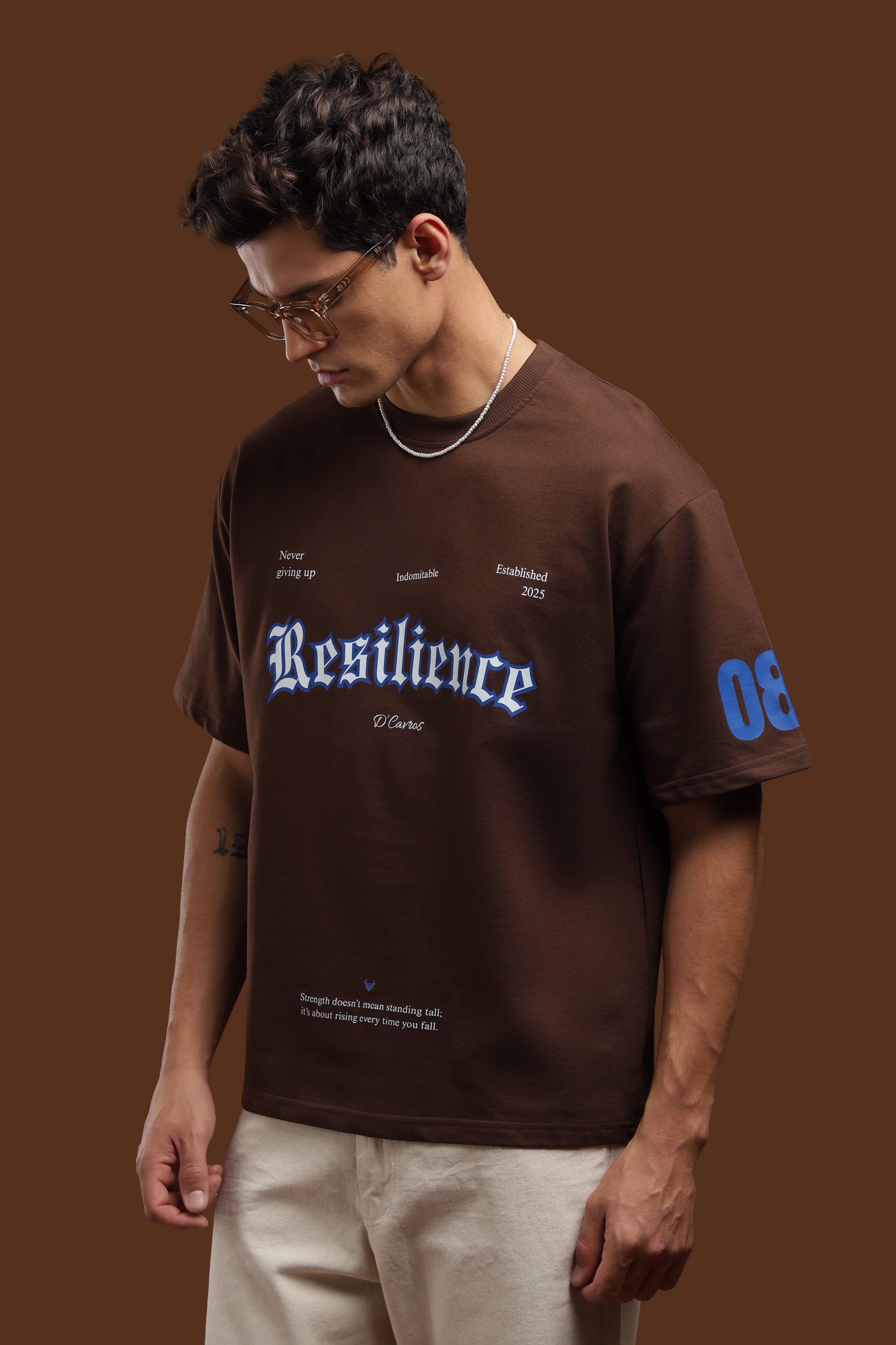 Loose Fit Resilience Printed T-Shirt featuring bold graphic typography on a relaxed silhouette.