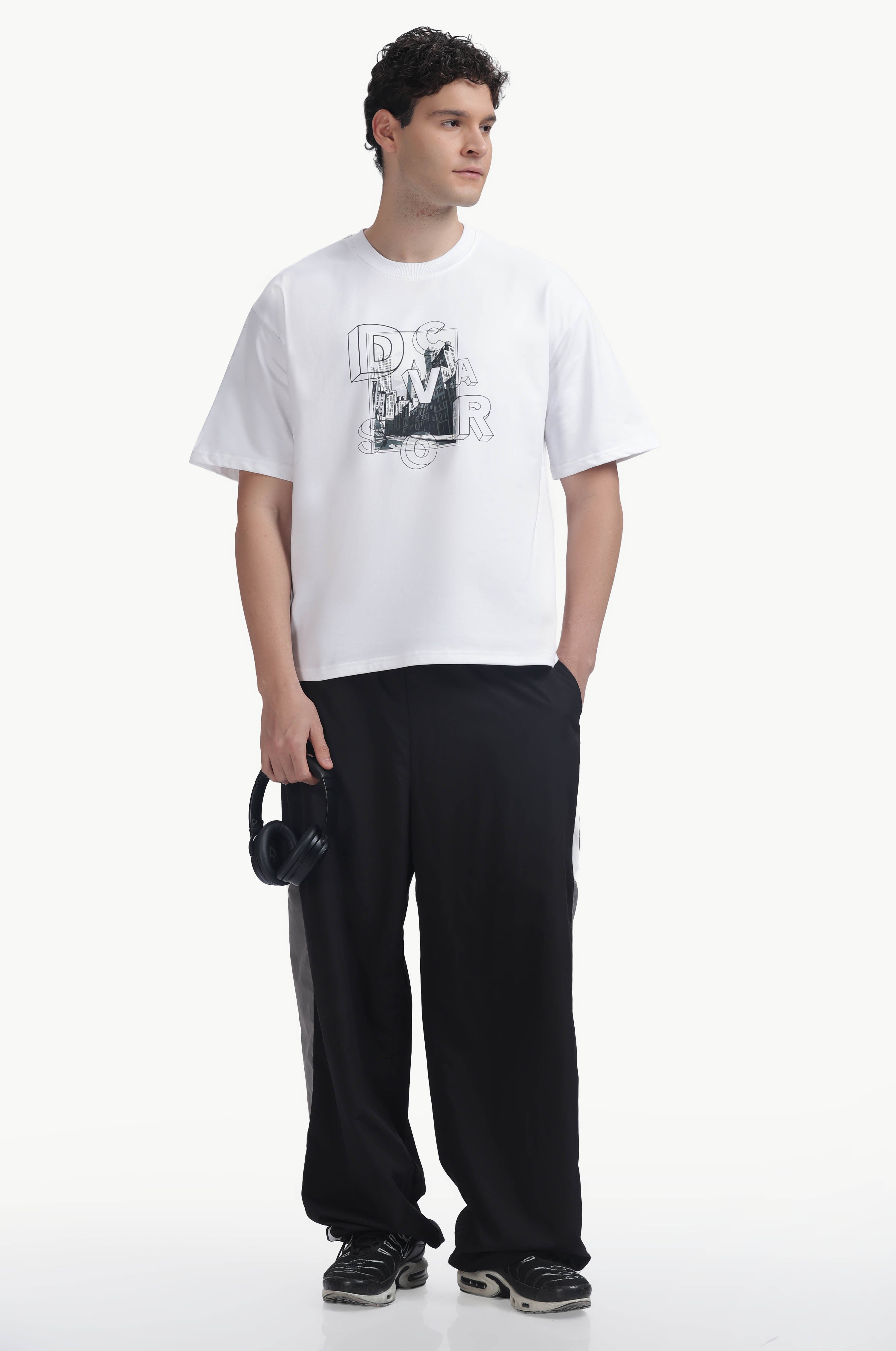 Loose Fit Graphics Printed T-Shirt worn with relaxed black pants, showcasing bold city graphic design.