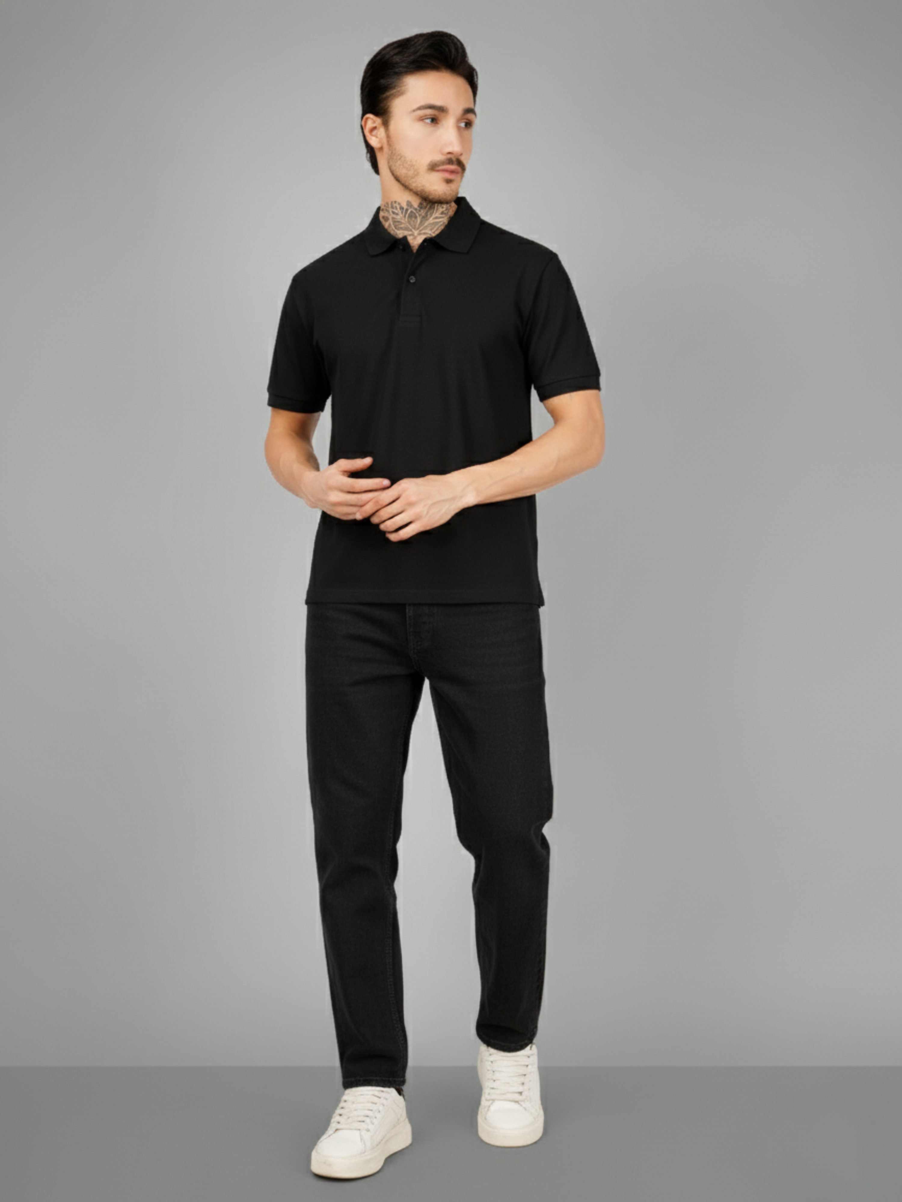 Man wearing a black polo shirt and pants on a gray background