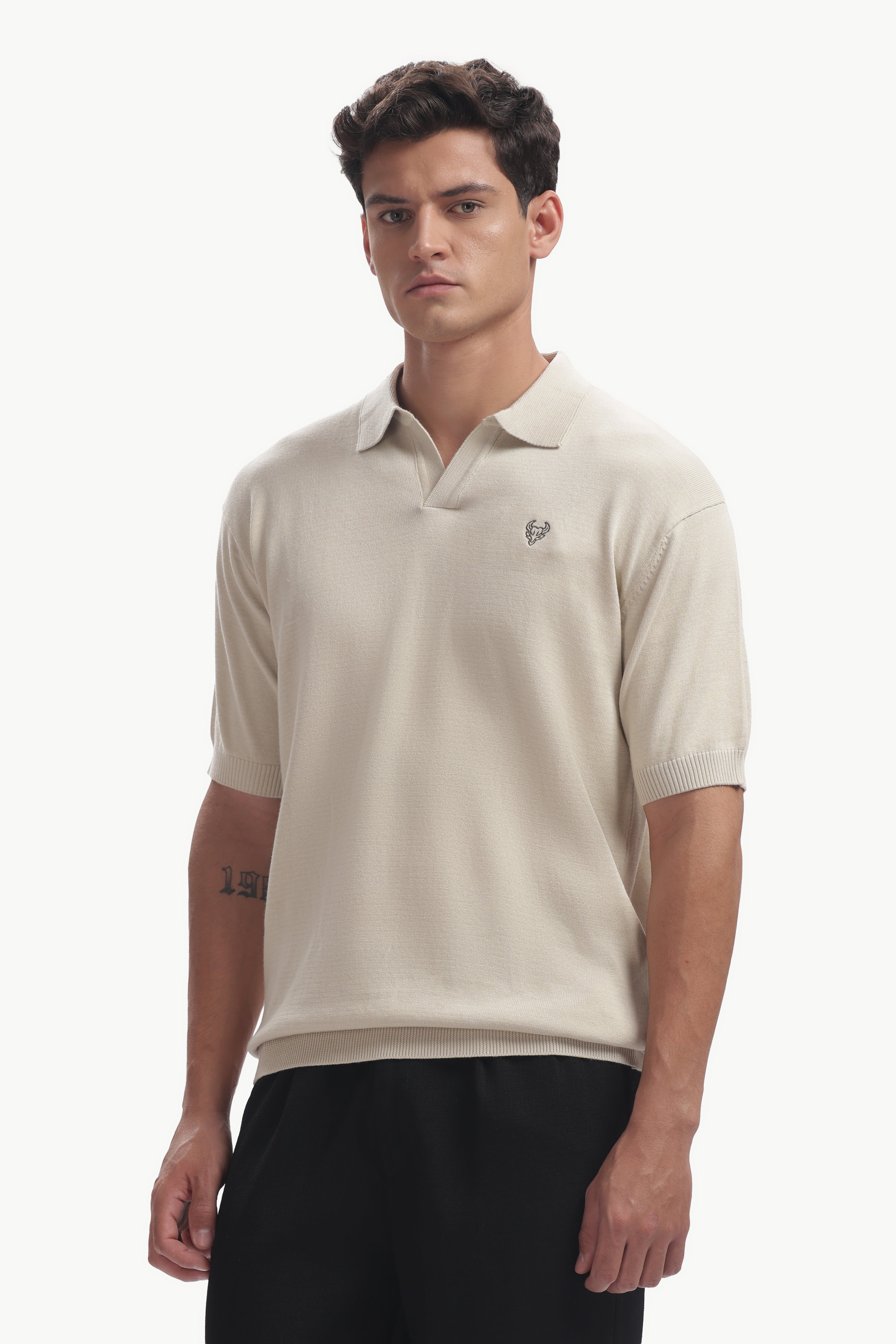 Classic Cotton-Knit Polo Shirt displayed on a male model in a refined neutral shade with structured collar.