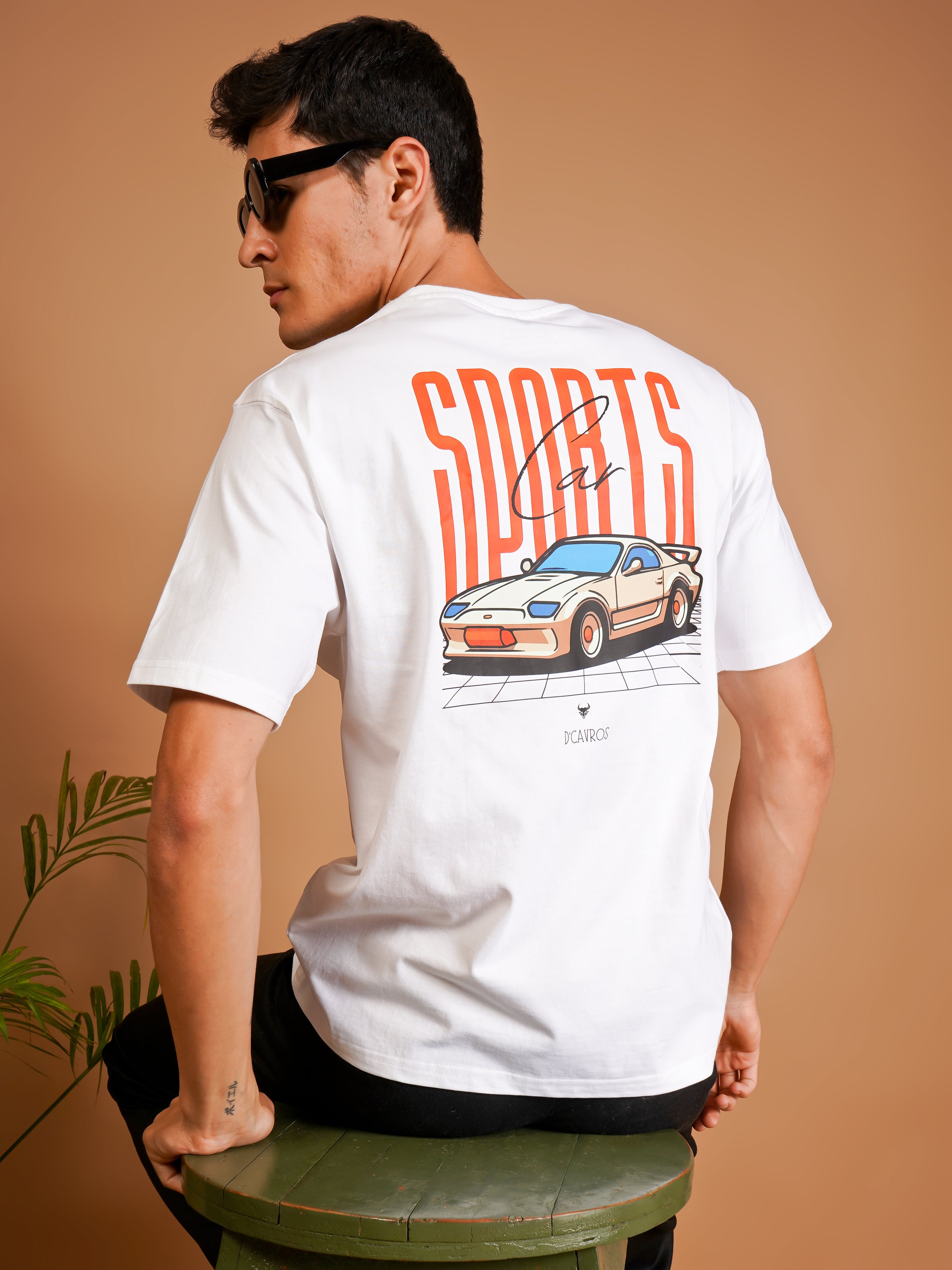 Model wearing Sports Car Oversized T-Shirt showcasing bold automotive graphics and relaxed fit.